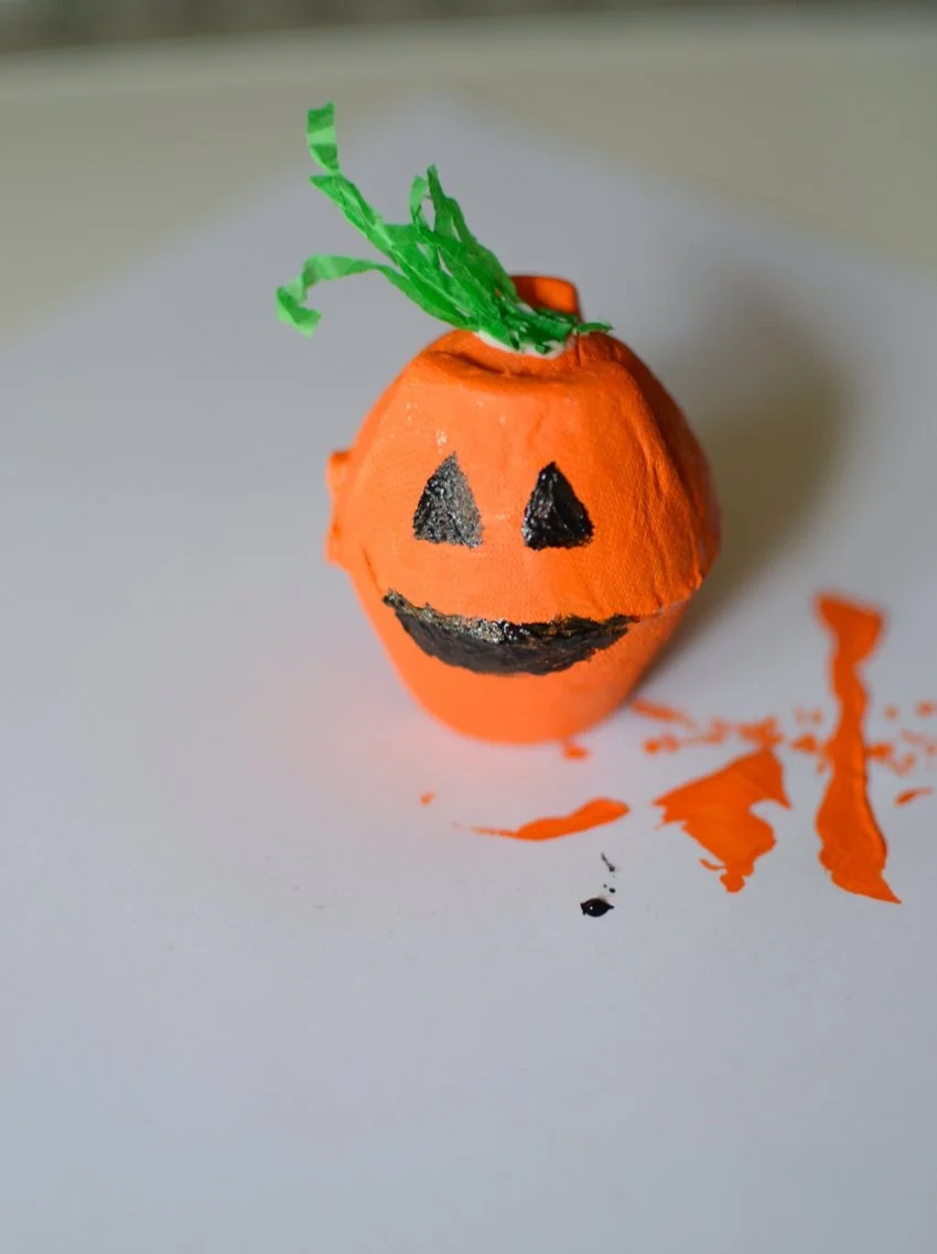 Children creating an easy pumpkin craft for Halloween