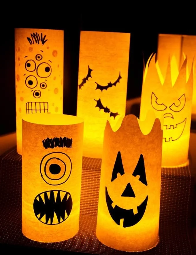 Colorful paper Halloween luminaries glowing in the dark