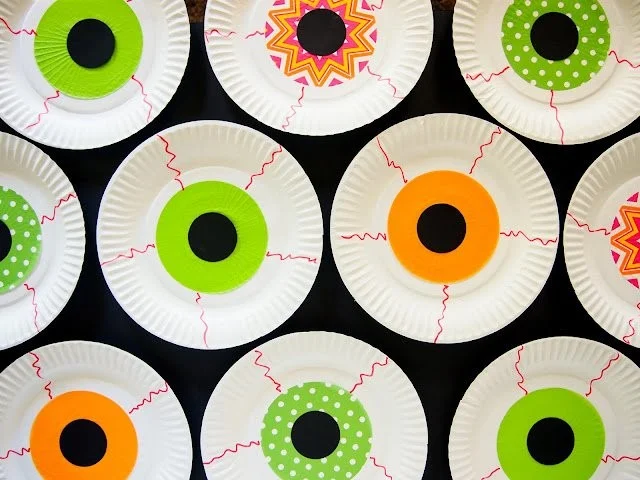 Halloween cupcake wrappers featuring spooky eyeball designs for festive parties